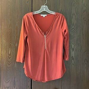 Green Envelope 3/4 sleeved clay colored top with zipper. Size Small